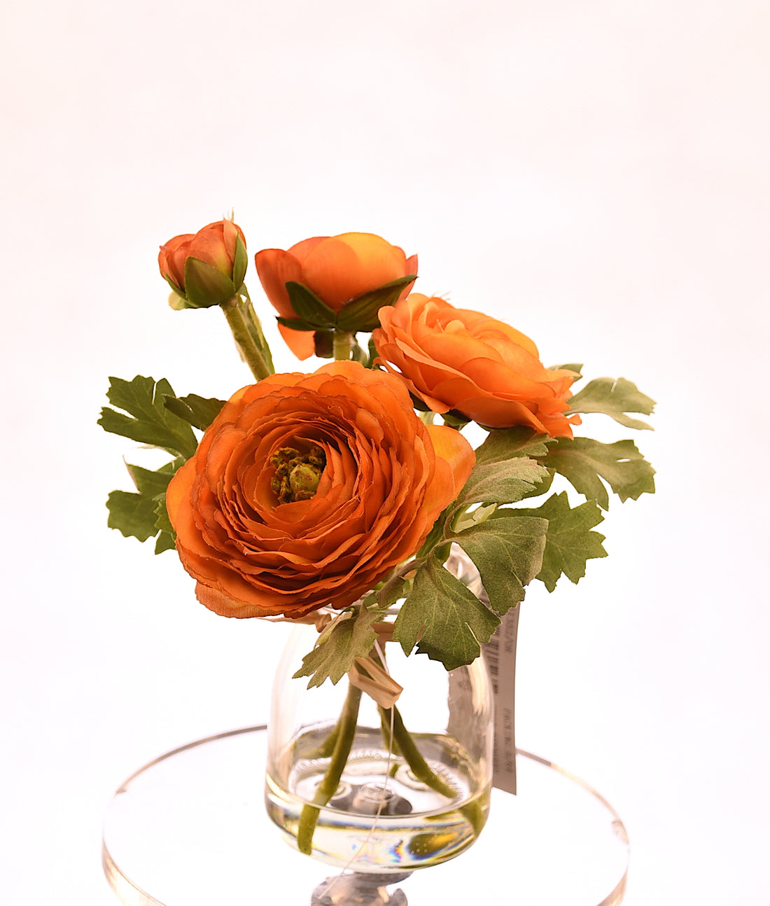 Arreglo de flores artificiales naranja de 18 cm en florero de vidrio